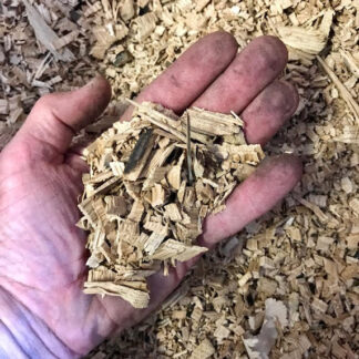 bourbon barrel smoking chips in hand